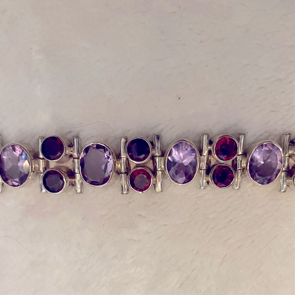 Sterling silver bracelet with beautiful amethyst and garnet stones.